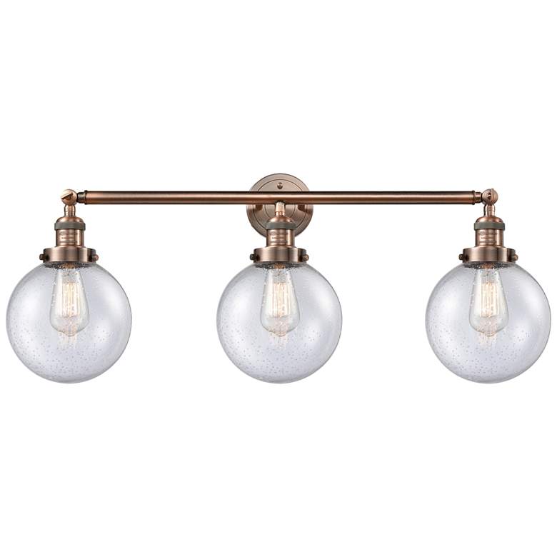 Image 1 Beacon 3 Light 32" Bath Light - Antique Copper - Seedy Shade