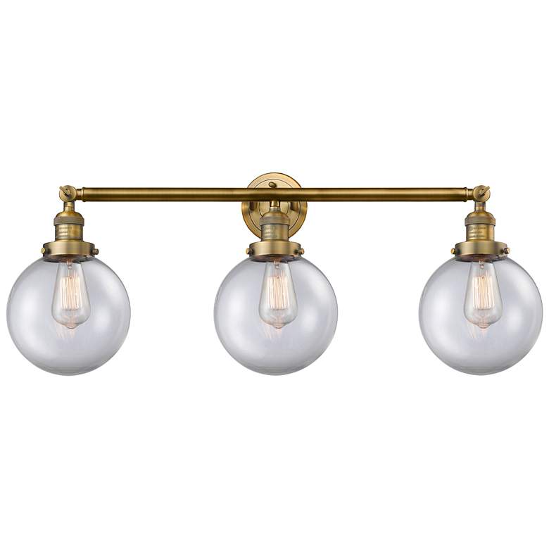 Image 1 Beacon 3 Light 32" Bath Light - Brushed Brass - Clear Shade