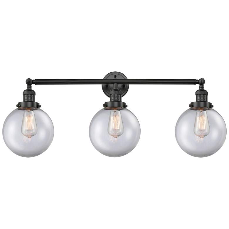 Image 1 Beacon 3 Light 32" Bath Light - Matte Black - Clear Shade