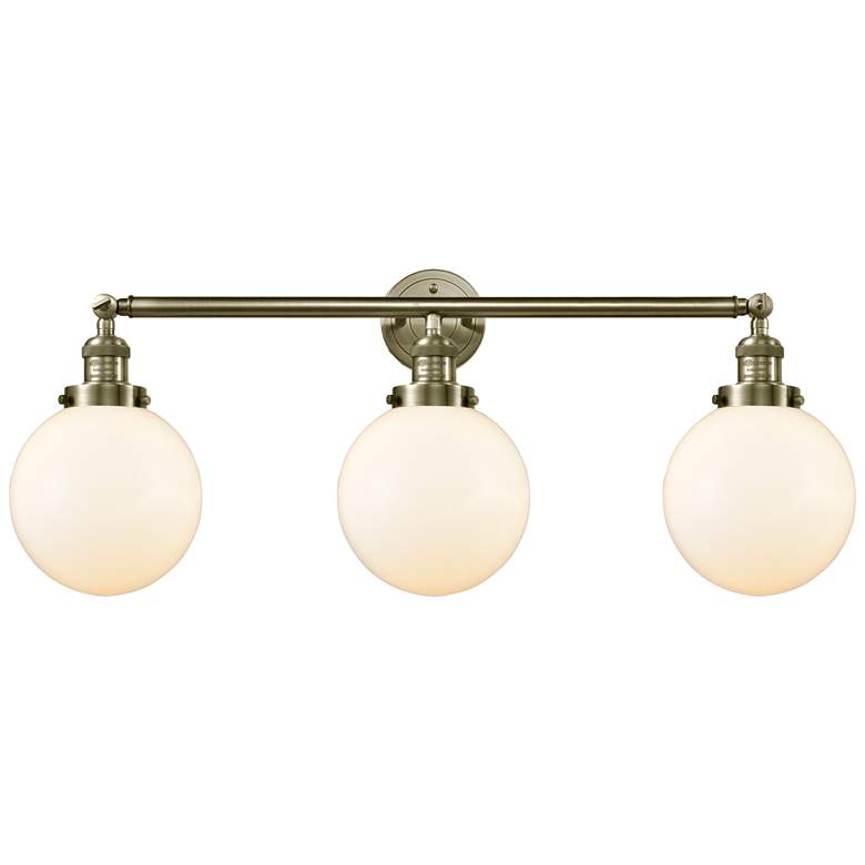 Image 1 Beacon 3 Light 32" LED Bath Light - Antique Brass - Matte White Shade