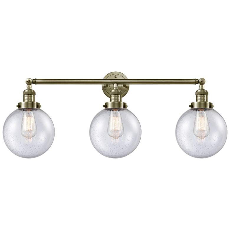 Image 1 Beacon 3 Light 32" LED Bath Light - Antique Brass - Seedy Shade