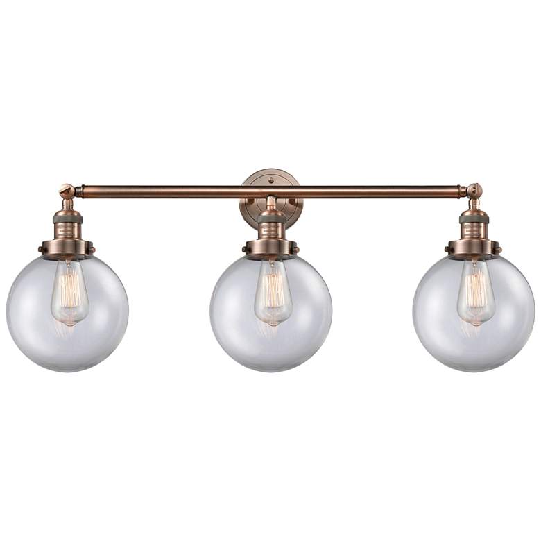 Image 1 Beacon 3 Light 32" LED Bath Light - Antique Copper - Clear Shade