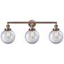 Beacon 3 Light 32" LED Bath Light - Antique Copper - Clear Shade
