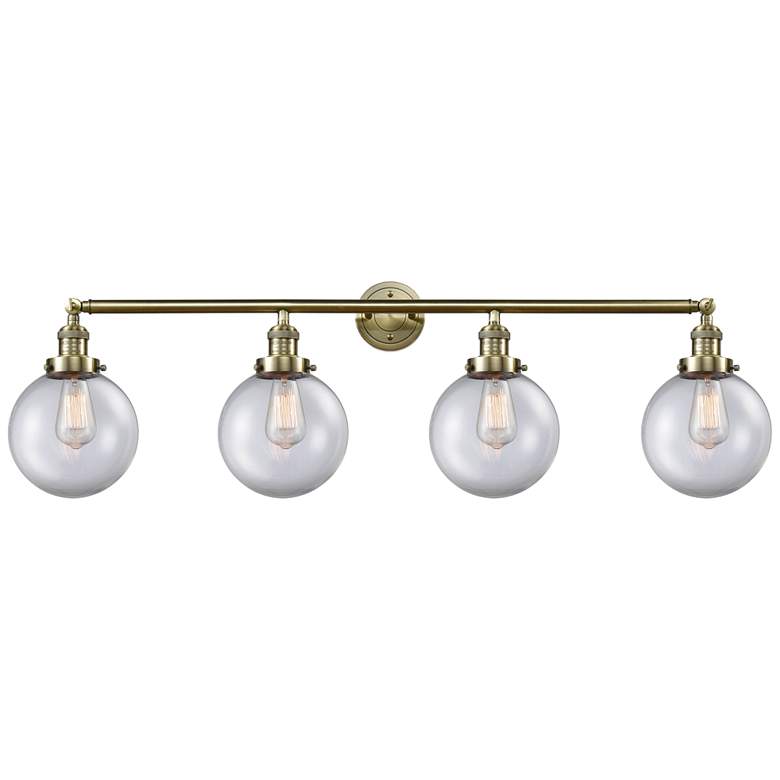 Image 1 Beacon 4 Light 44" Bath Light - Antique Brass - Clear Shade