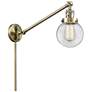 Beacon 6" Antique Brass LED Swing Arm With Clear Shade