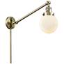 Beacon 6" Antique Brass Swing Arm With Matte White Shade