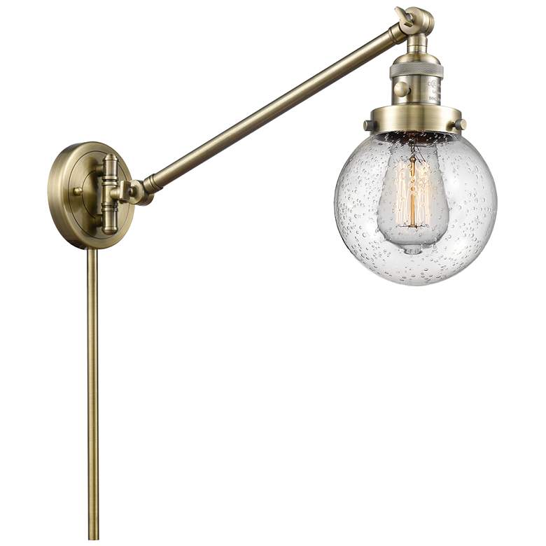Image 1 Beacon 6" Antique Brass Swing Arm With Seedy Shade