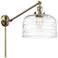 Bell 12" Antique Brass LED Swing Arm With Clear Deco Swirl Shade