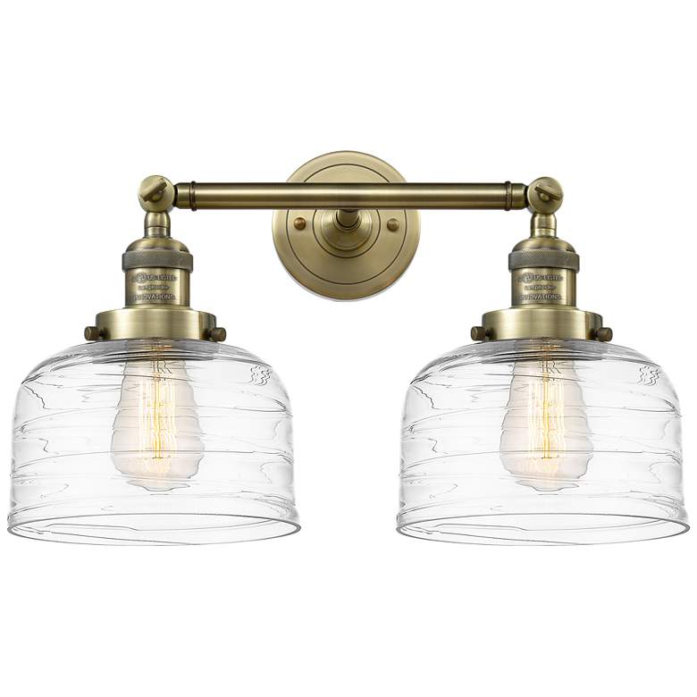 Image 1 Bell 2 Light 19" Bath Light - Antique Brass - Clear Deco Swirl Shade