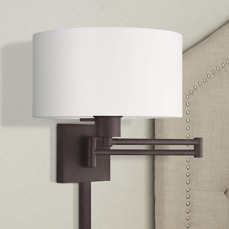 Image 1 Bronze Swing Arm Wall Lamp with Off-White Fabric Drum Shade