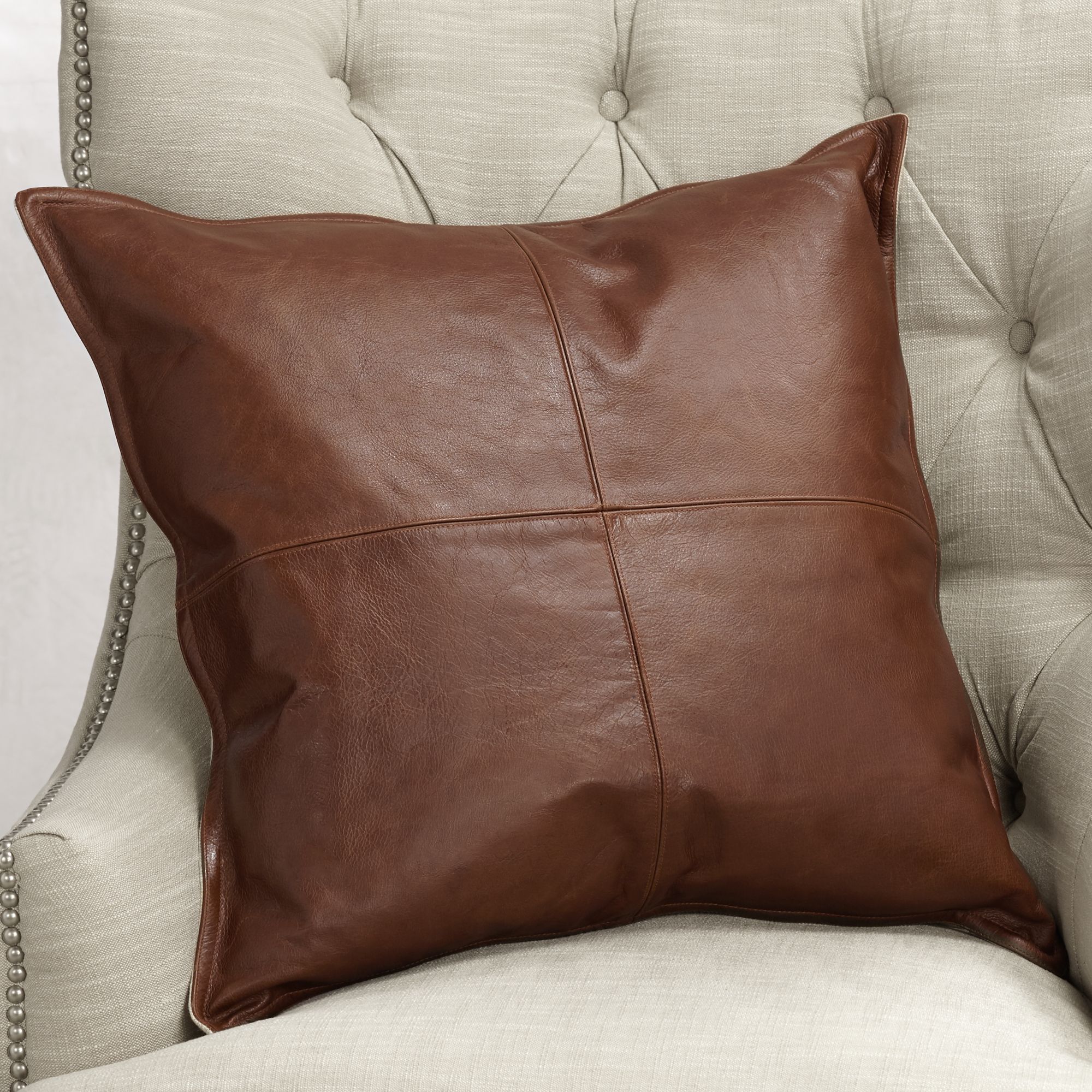 brown leather throw pillow