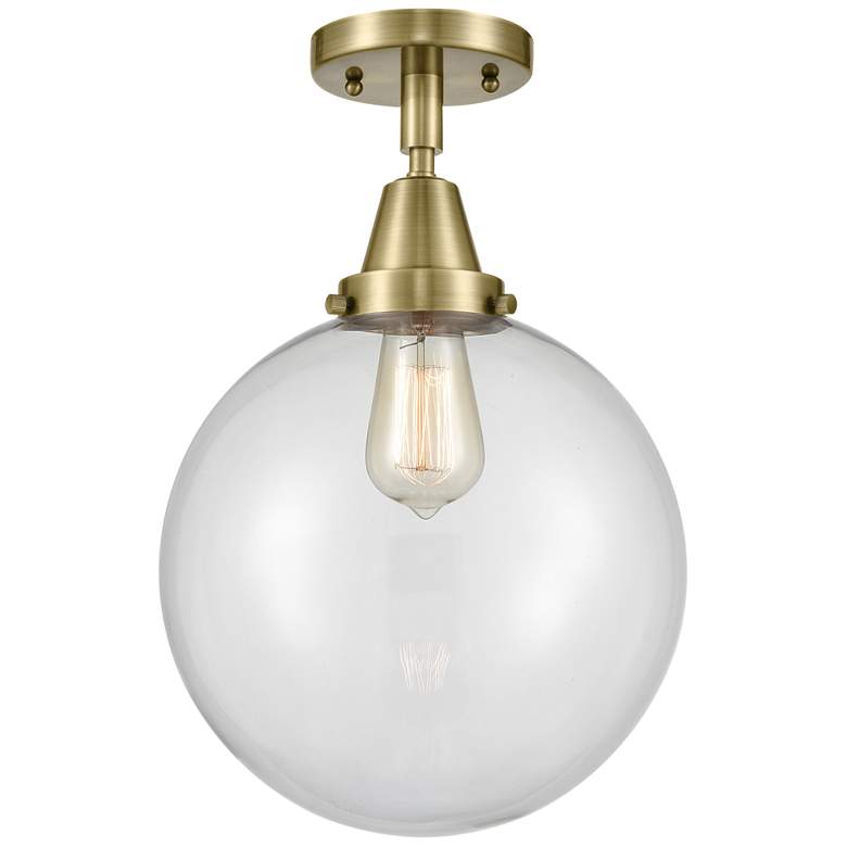 Image 1 Caden Beacon 10" Flush Mount - Antique Brass - Clear Shade