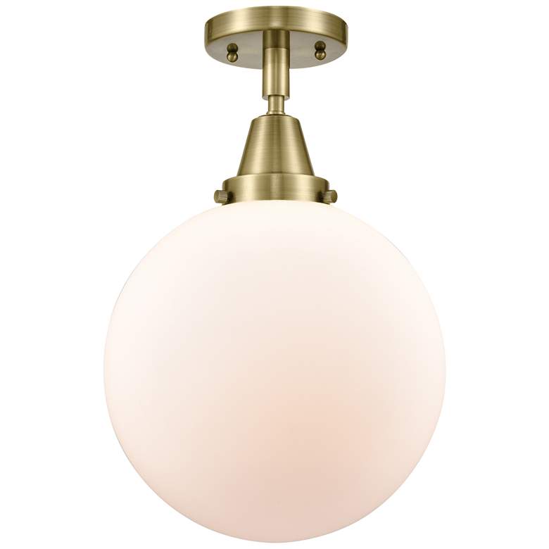Image 1 Caden Beacon 10" Flush Mount - Antique Brass - Matte White Shade