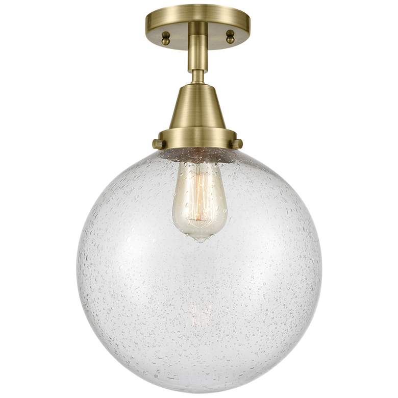 Image 1 Caden Beacon 10" Flush Mount - Antique Brass - Seedy Shade