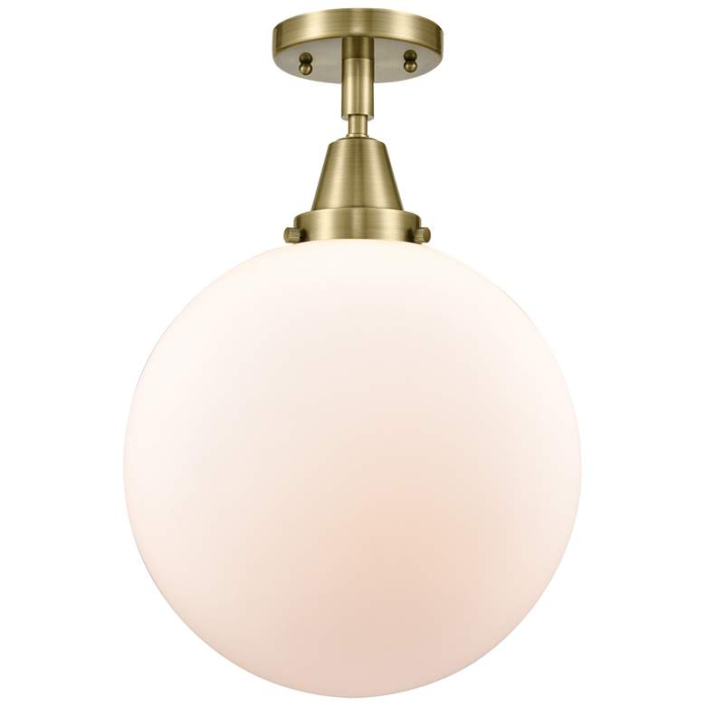 Image 1 Caden Beacon 12" LED Flush Mount - Antique Brass - Matte White Shade