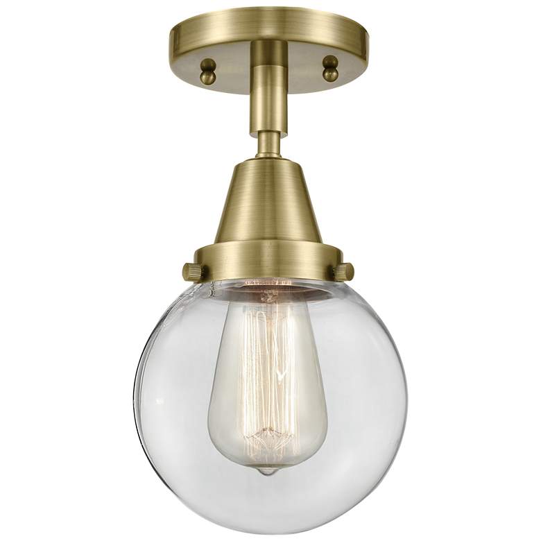 Image 1 Caden Beacon 6" Flush Mount - Antique Brass - Clear Shade