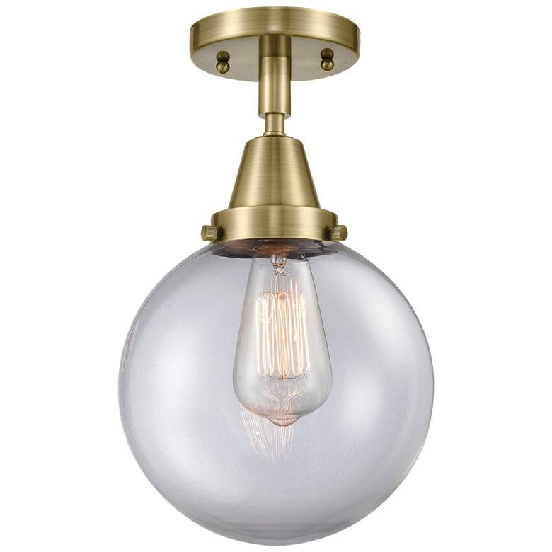 Image 1 Caden Beacon 8" Flush Mount - Antique Brass - Clear Shade