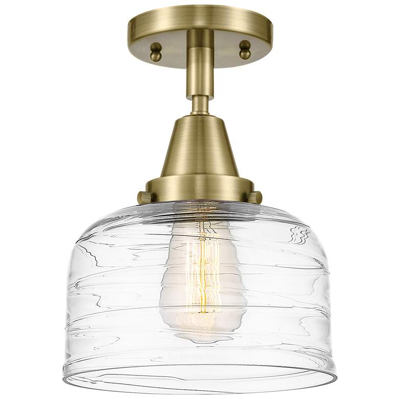 Image 1 Caden Bell 8" LED Flush Mount - Antique Brass - Clear Deco Swirl Shade