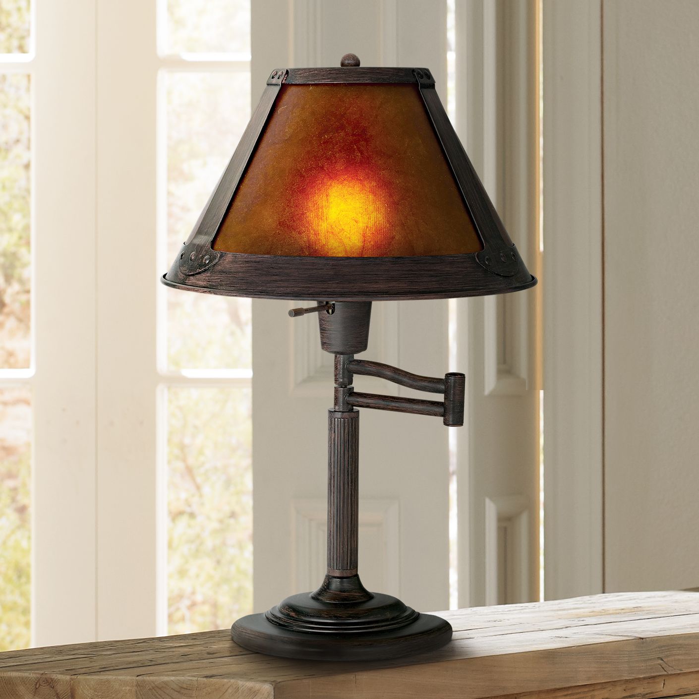 Swing arm clearance table lamps