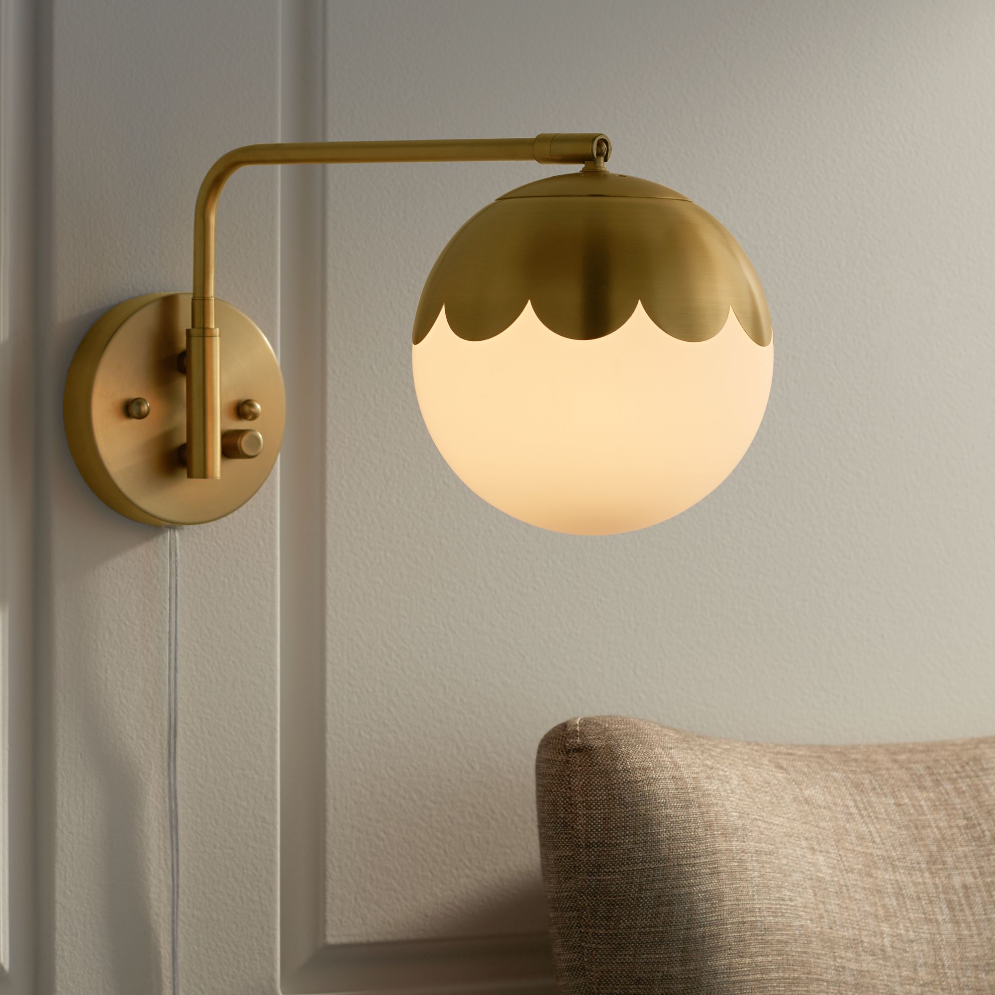 Watch A Video About the Camila Brass and Glass Globe Plug In Wall Lamp