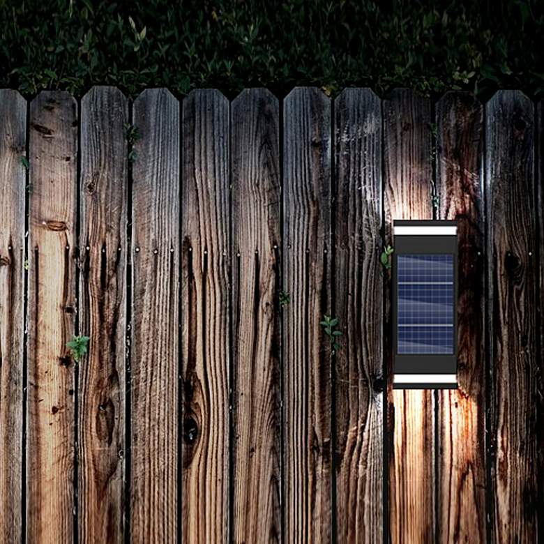 Image 1 Cole 9 1/4" High Black LED Dual Direction Solar Wall Light