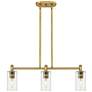Crown Point 30.5"W 3 Light Brushed Brass Stem Island Light w/ Clear Sh