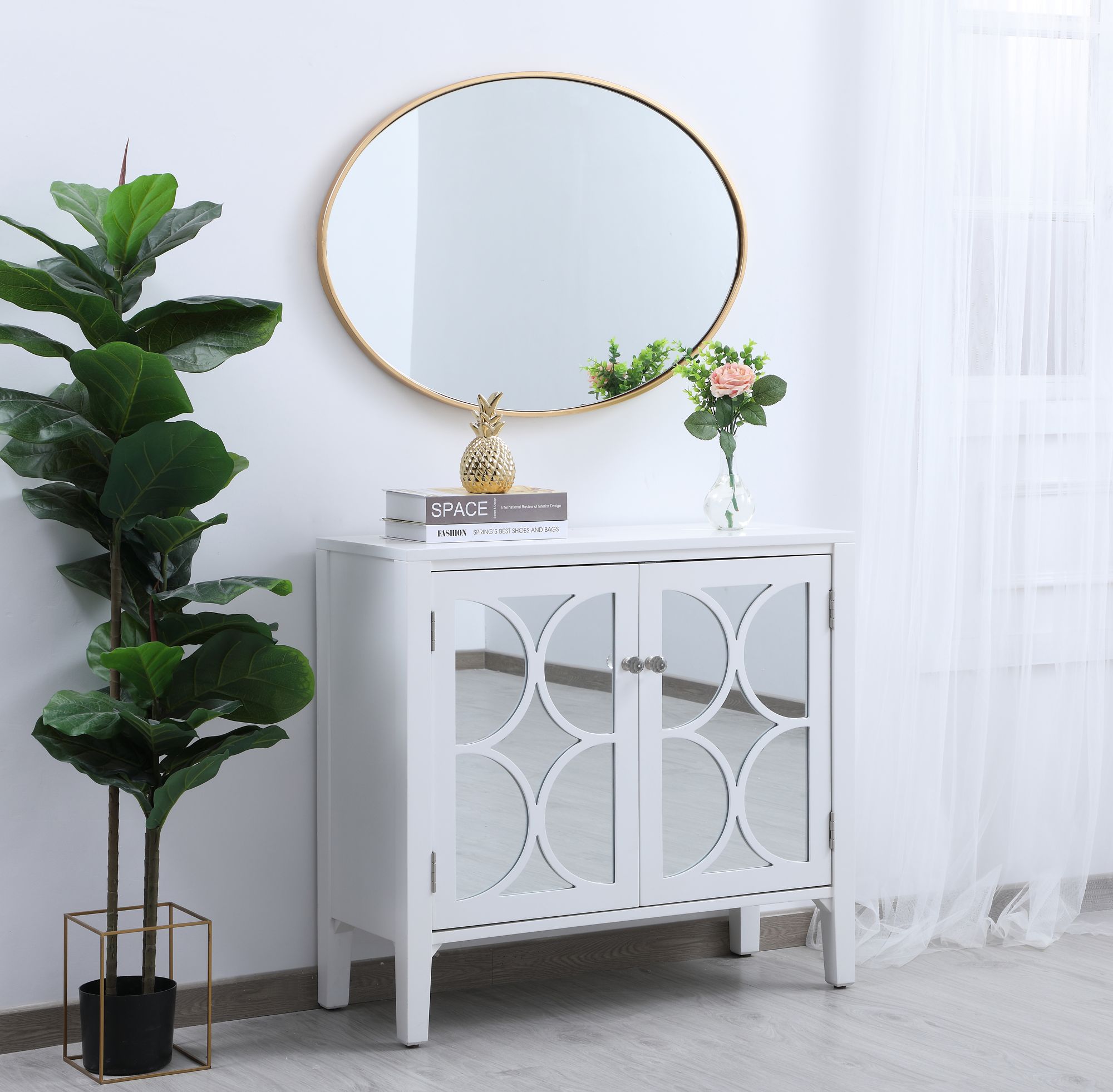 Decker Brass Metal 34" x 24" Oval Vanity Wall Mirror in scene