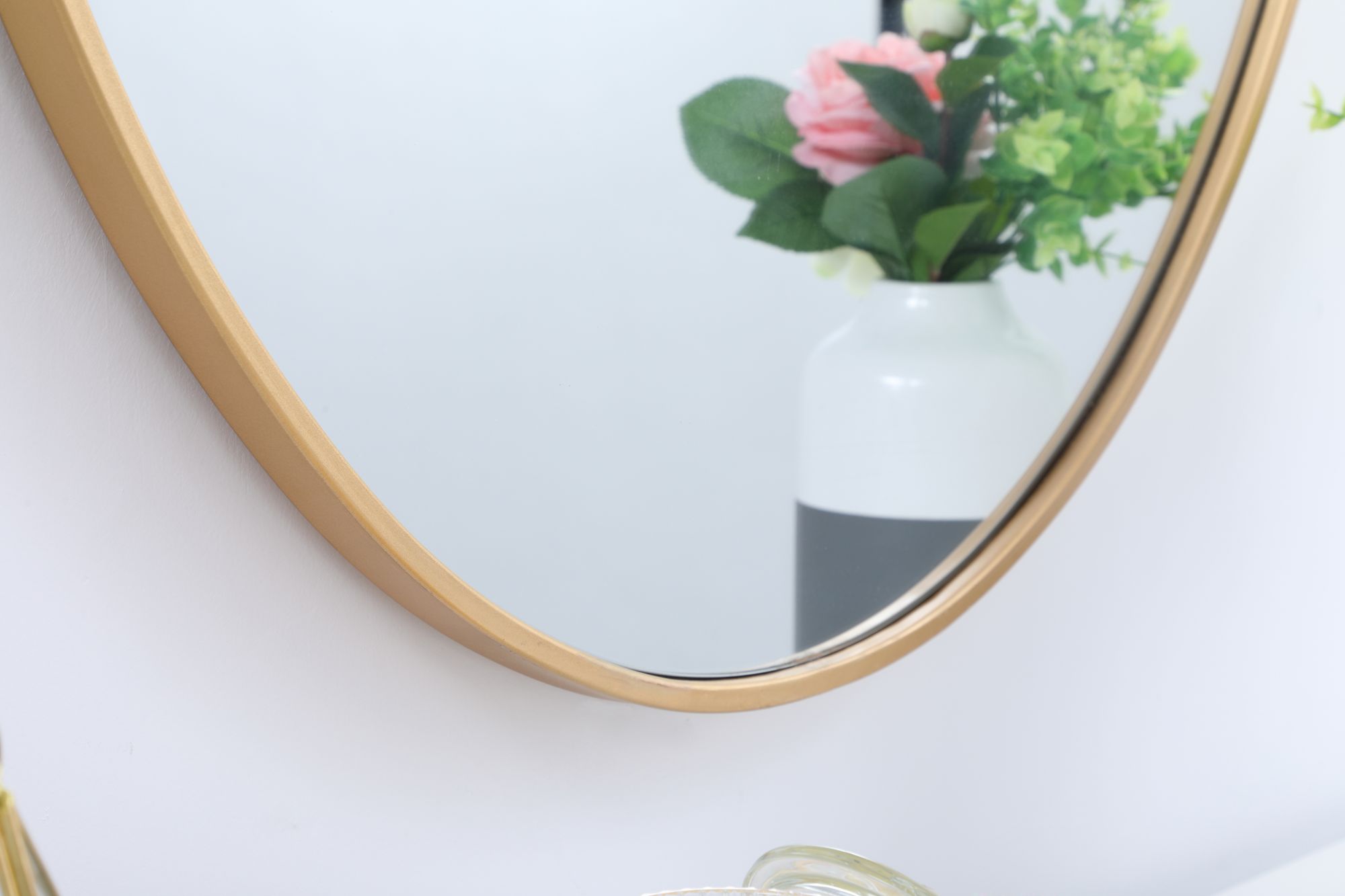 Decker Brass Metal 34" x 24" Oval Vanity Wall Mirror in scene