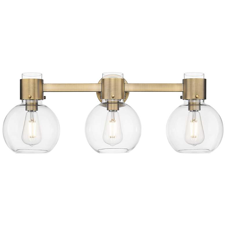 Image 1 Downtown Lawton Sphere 24"W 3 Light Brass Vanity Light w/ Clear Shade