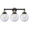 Edison Beacon 24.5"W 3 Light Black Brass Bath Light With Seedy Shade