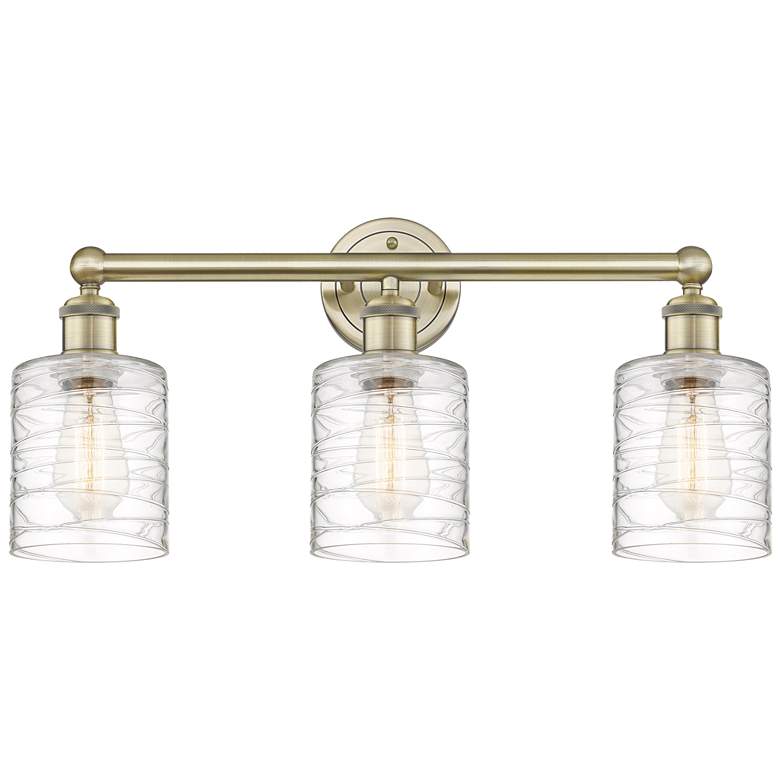 Image 1 Edison Cobbleskill 23"W 3 Light Antique Brass Bath Light w/ Swirl Shad