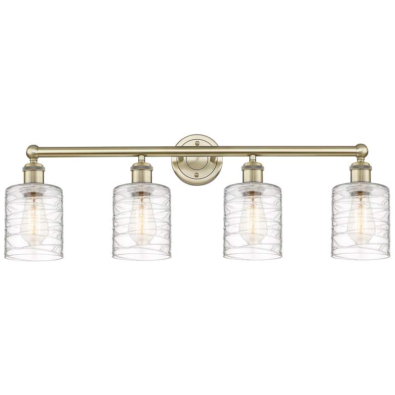 Image 1 Edison Cobbleskill 32"W 4 Light Antique Brass Bath Light w/ Swirl Shad