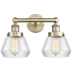 Edison Fulton 15.5"W 2 Light Antique Brass Bath Light With Clear Shade