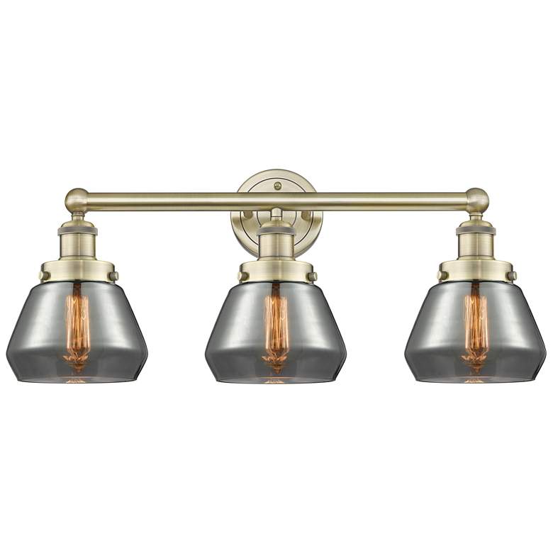 Image 1 Edison Fulton 24.5"W 3 Light Antique Brass Bath Light With Smoke Shade