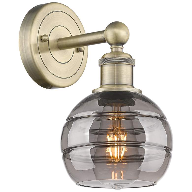 Image 1 Edison Rochester 10.13" High Antique Brass Sconce With Light Smoke Sha