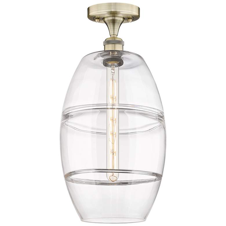 Image 1 Edison Vaz 10" Wide Antique Brass Semi-Flush Mount With Clear Shade