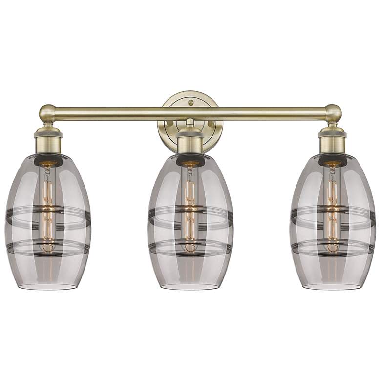 Image 1 Edison Vaz 23.88"W 3 Light Antique Brass Bath Light w/ Light Smoke Sha