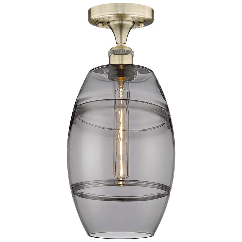Image 1 Edison Vaz 8" Wide Antique Brass Semi-Flush Mount With Light Smoke Sha