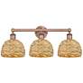 1_Edison Woven Rattan 26" Wide 3 Light Antique Copper Vanity Light With