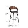 Elm Lane Larsen 26" High Modern Black and Walnut Swivel Counter Stool in scene