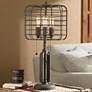 Franklin Iron Works 30" Industrial Cage 3-Light Rust Metal Table Lamp in scene