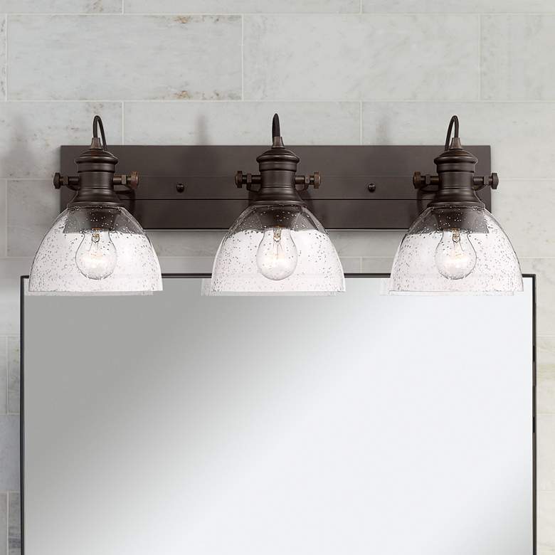 Image 1 Golden Lighting Hines 25 1/4" Bronze Seeded Glass 3-Light Bath Light