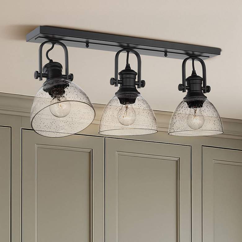 Image 1 Golden Lighting Hines 25" Seeded Glass Matte Black Bath Light