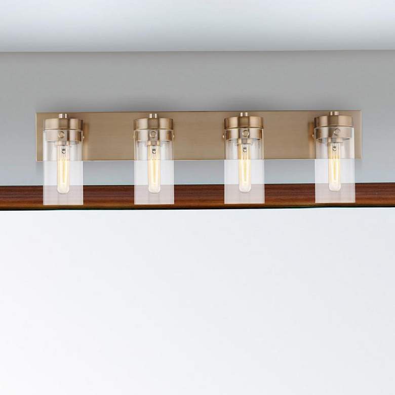 Image 1 Intersection; 4 Light; Vanity; Burnished Brass with Clear Glass