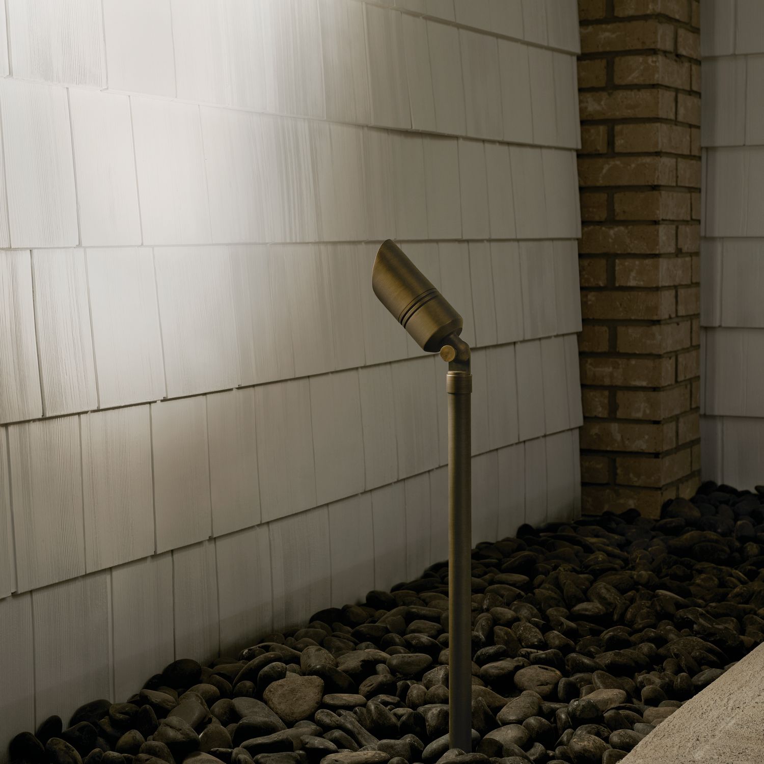 James 19" High Centennial Brass Male Female Landscape Riser in scene