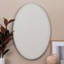 Jessyca Glossy Silver Metal 24 1/2" x 35" Oval Wall Mirror