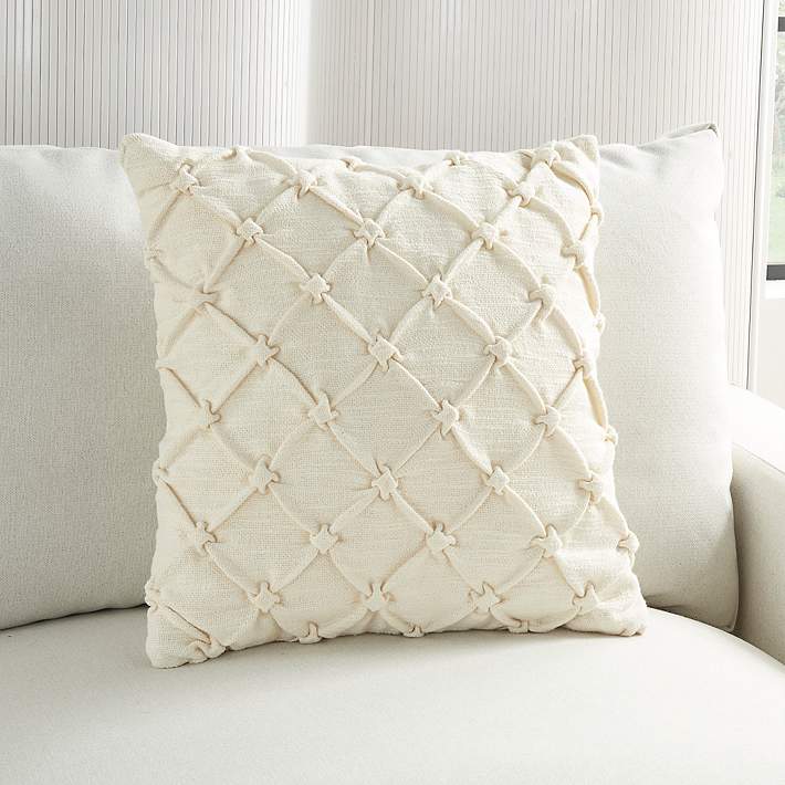 https://image.lampsplus.com/is/image/b9gt8/kathy-ireland-ivory-pin-tucked-18-inch-square-throw-pillow__395k3cropped.jpg?qlt=65&wid=710&hei=710&op_sharpen=1&fmt=jpeg