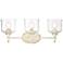 Keating 3 Light Bath Vanity in Antique Ivory w Hammered Water Glass Shade