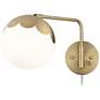 Kelowna Antique Brass and Glass Globe Swing Arm Plug-In Wall Lamp in scene