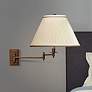 Kinetic Collection Brass Pleated Shade Plug-In Swing Arm in scene